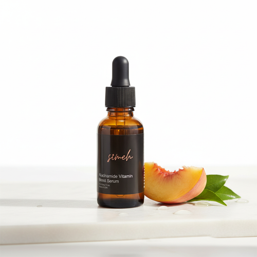 Niacinamide vitamin boost serum with peach on white marble - professional product photography